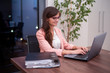 © vvkoticch - Businesswoman working on laptop in office