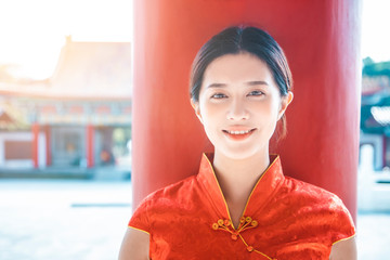 Asian young woman in old traditional Chinese dresses in the Temple