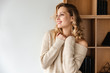© Drobot Dean - Positive optimistic young woman posing indoors at home.
