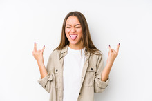 Young Caucasian Woman  Isolated Showing Rock Gesture With Fingers