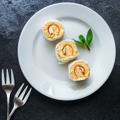 coconut sponge cake roll biscuit (delicious sweet dessert) menu concept. background. top view. copy space