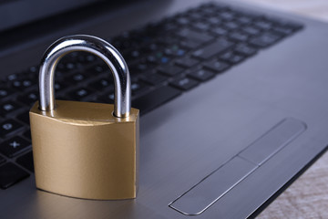 Padlock on computer keyboard. Internet data privacy information security concept.