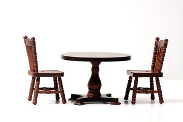 doll house interior - two chairs and a table isolated on white background