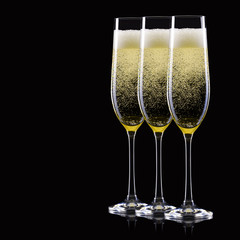 Wall Mural - Set of luxury champagne glasses in a row isolated on a black background