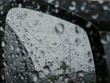 Raindrops on the glass, rearview mirror of the car in traffic