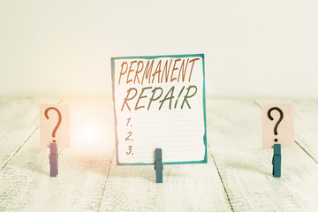 Writing note showing Peranalysisent Repair. Business concept for A repair of an asset that is enduring and lasting Crumbling sheet with paper clips placed on the wooden table