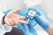 © Proxima Studio - Doctor checking blood sugar level with glucometer