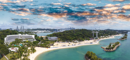 Wall Mural - Panoramic aerial view of Siloso Beach and Sentosa Island at sunset, Singapore