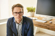 © marvent - Serious young professional in suit jacket and spectacles