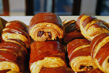 Wall Mural - Freshly baked chocolate croissants in a French bakery