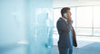 © marvent - Modern businessman in new office talking on his mobile phone