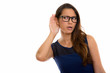 © Ranta Images - Studio shot of young beautiful woman listening