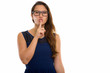 © Ranta Images - Studio shot of young beautiful woman with finger on lips