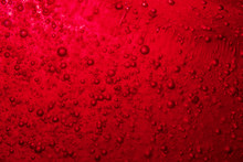 Red Bubble Floating To The Top Of Liquid 