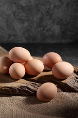 Group of of raw chicken eggs on rustic background, Organic eggs in loft style kitchen