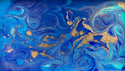 marbled blue and gold abstract background. liquid marble pattern.