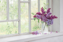 Bouquet Of Lilacs In A Glass Jug