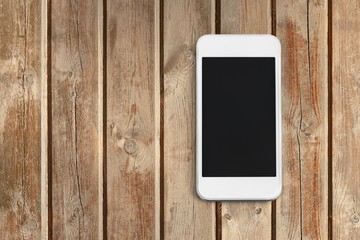 Poster - Modern touch screen smartphone on wooden desk