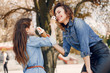 © prostooleh - Fashionable mother with daughter. Family in a spring park. Woman in a blue shirt