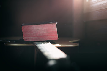 Wall Mural - Close up the Bible on acoustic guitar with light in morning, christian worship concept.