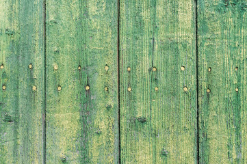 Wall Mural - Old weathered green wooden boards closeup as green wooden background