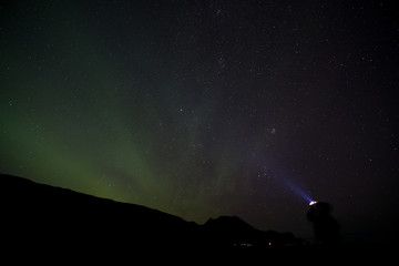 iceland aurora borealis north lights night sky with moon and stars