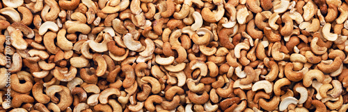 Fotografía Cashew nuts peeled full background. Panorama. Banner.