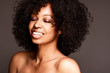© James Mosley - Portrait of a smiling young attractive African American woman with curly hair and clean fresh face