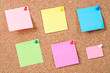 © gamjai - Blank sticky notes pinned.