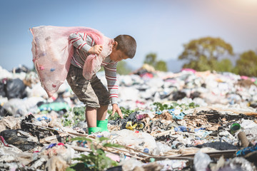 poor children collect garbage for sale because of poverty, junk recycle, child labor, poverty concep