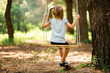 © Svetlana - Happy Little girl on a swing in the summer park