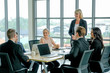 © narong - Group of business men and women in the conference or meeting to discuss about their company working.