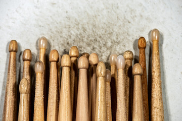 Wall Mural - Close-up of many wooden drumsticks on an old and dirty snare drum. Percussion instrument