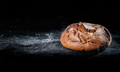 Freshly baked bread on dark background