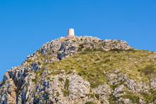 Mountain With Tower On The Top In North East Of Mallorca. Cap De Formentor. Spain