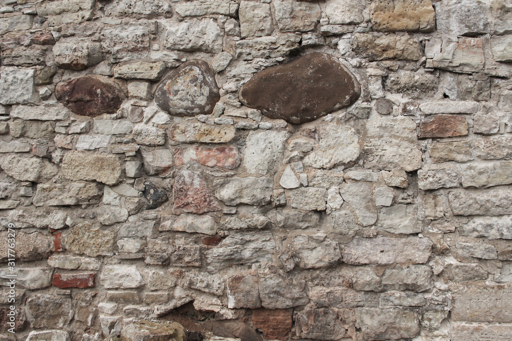 Old wall made of rocks. Medieval surface made of bricks. Texture of an ...