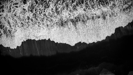 view of black sand beach atlantic ocean waves in Iceland