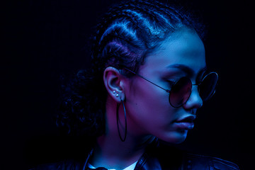 fashion young african girl black woman hold stylish pink glasses looking at the camera isolated on a