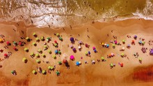 AERIAL VIEW OF PEOPLE ON BEACH