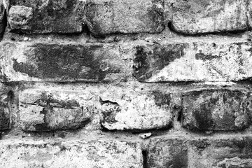 Texture of a brick wall with cracks and scratches which can be used as a background