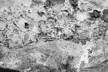 Texture of a concrete wall with cracks and scratches which can be used as a background