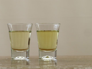 two glasses of cachaça, with space for text