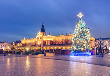 Krakow, Poland, Main Square And Cloth Hall In The Winter Season, During Christmas Fairs Decorated With Christmas Tree.