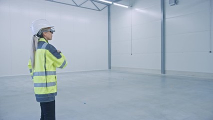 Poster - Industry 4.0 Factory: Female Engineer Wearing Augmented Reality Headset Uses Mixed Reality Software, Gestures for Mapping Manufacturing Plant Floor for Future Machinery, Factory Floor Layout. Mock-up