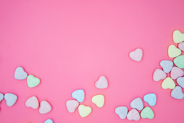 heart shape message letter candy on pink background. valentines day concept.