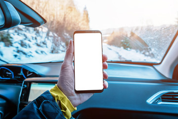 Phone mockup in the car passenger's hand. Isolated display to promote app design. The concept of using a phone in a car while traveling