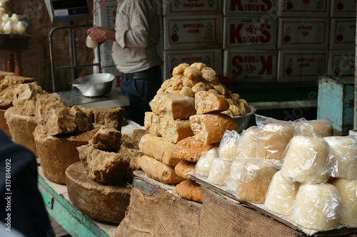 Jaggery raw sugar for sale in market, unrefined palm sugar comes in different colours. Natural and caramel sweetneess