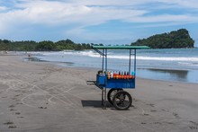 Wide Shot Of A Street Food Cart Placed In A Sandy Beach