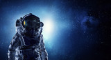 Fototapeta Kosmos - Astronaut pioneer doing research. Mixed media
