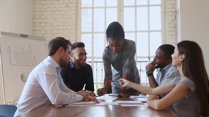 Wall Mural - Young female caucasian professional sharing marketing strategy ideas.